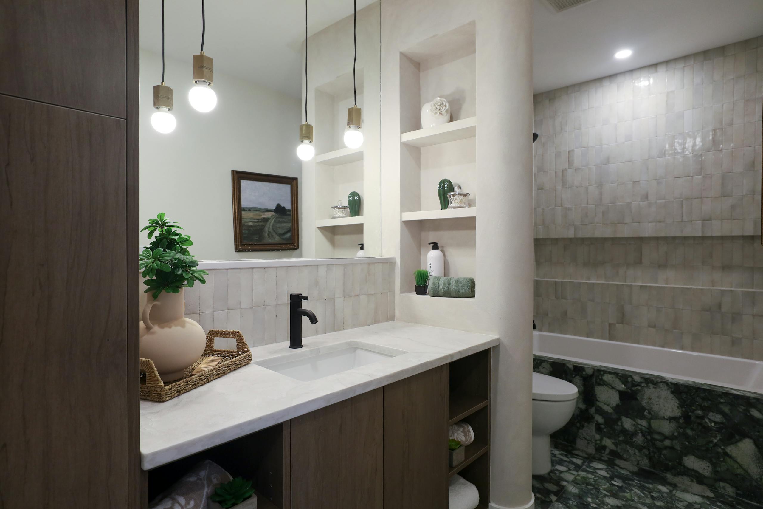 Stylishly designed bathroom showcasing modern fixtures and elegant decor in a minimalistic style.