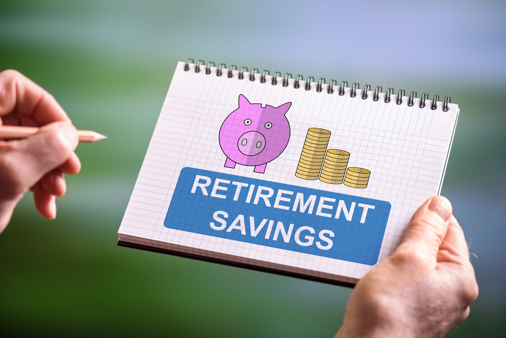 Hand drawing retirement savings concept on a notepad