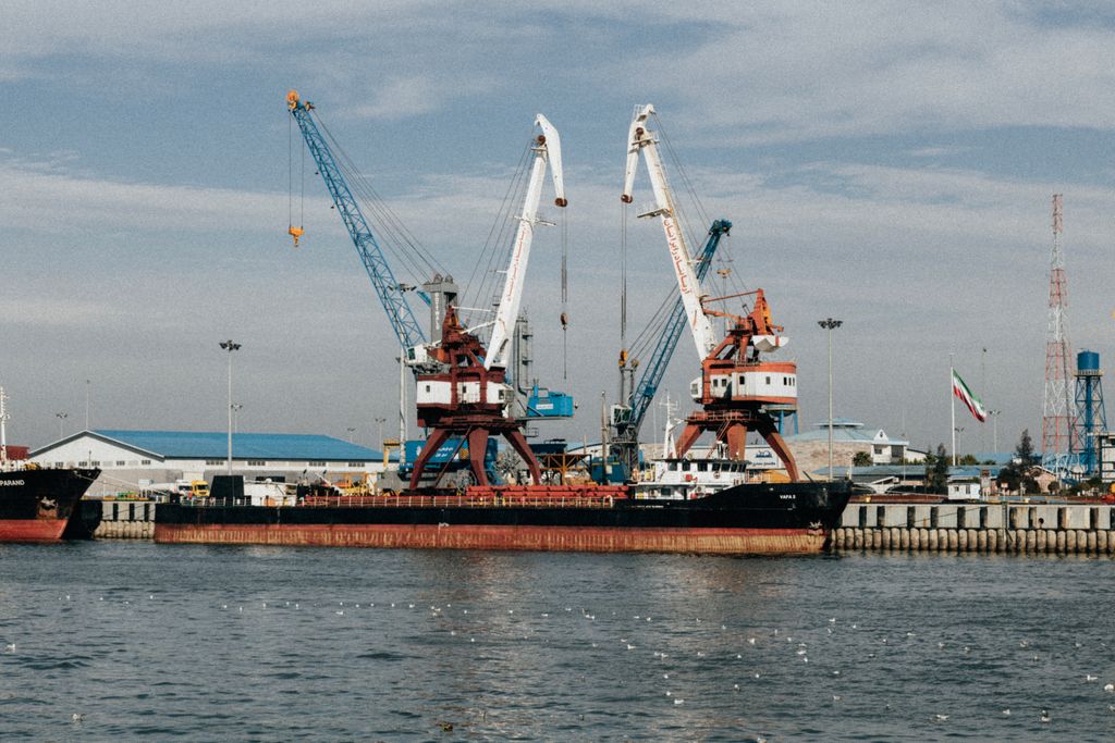 Cargo ships and cranes at the industrial port in Rasht, Gilan Province, Iran.