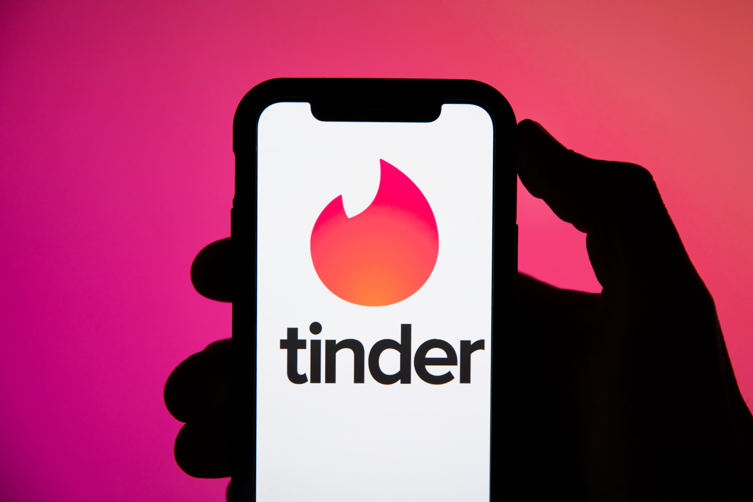 LONDON, UK - April 29 2020: Tinder online dating app logo on a smartphone