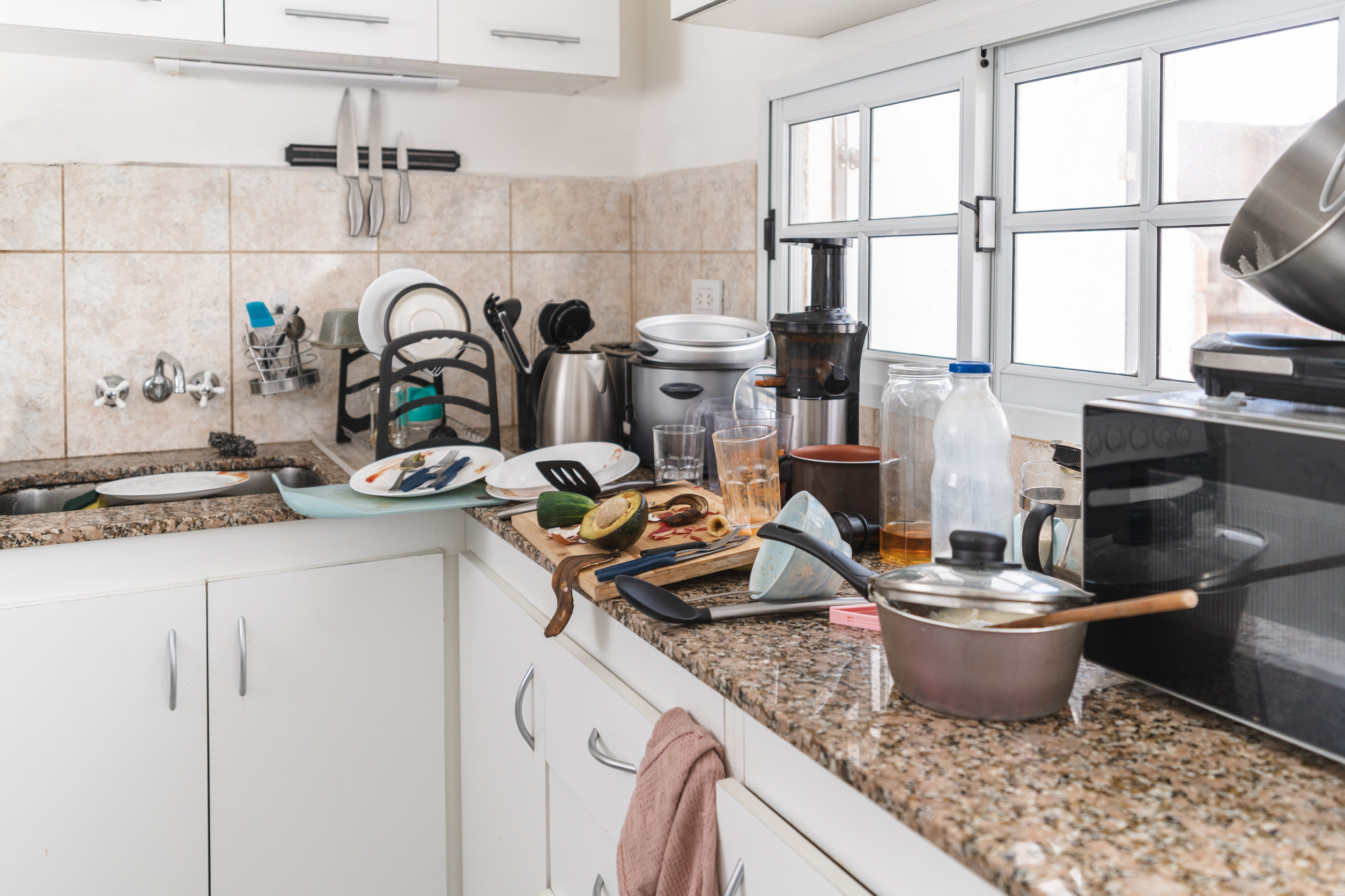 Morning chaos in the kitchen full of dirty dishes and rubbish everywhere. close-up