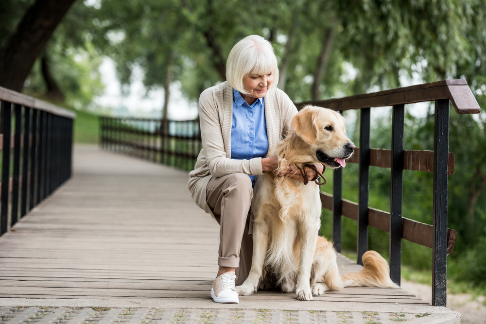 senior woman with dog walk