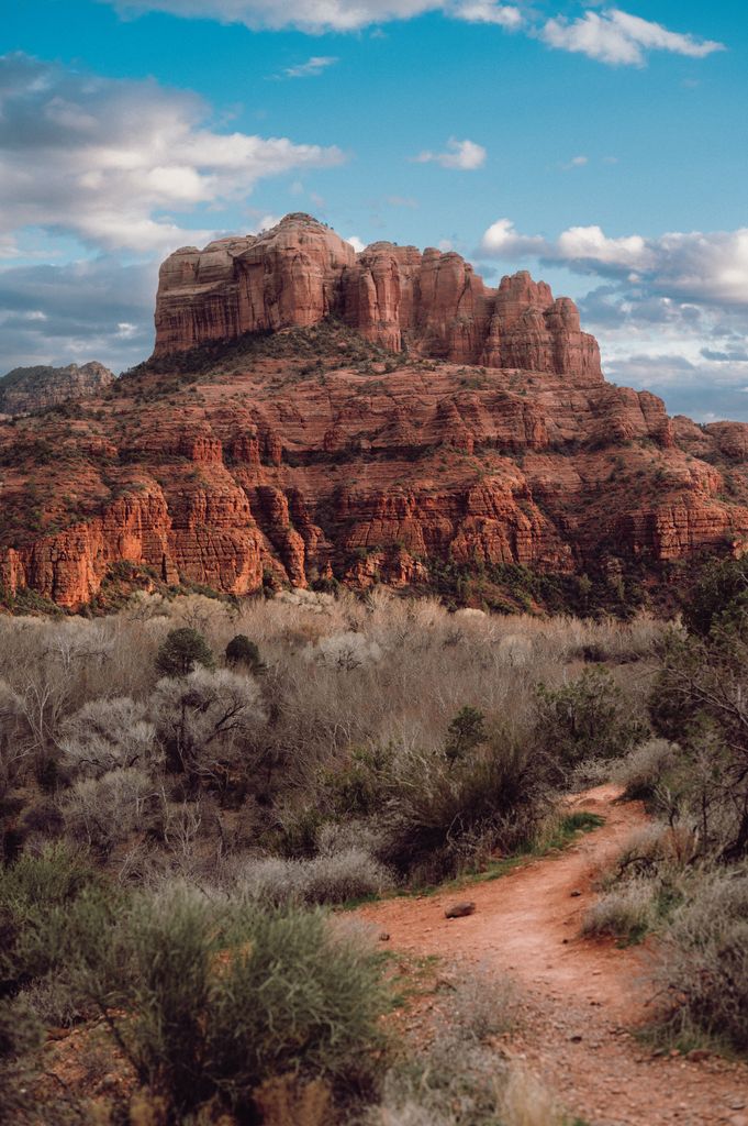 Breathtaking landscape featuring the iconic Cathedral Rock in Sedona under a vivid blue sky.
