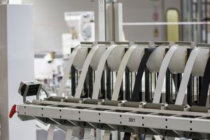 Modern industrial machine in operation in a manufacturing facility showcasing advanced technology.
