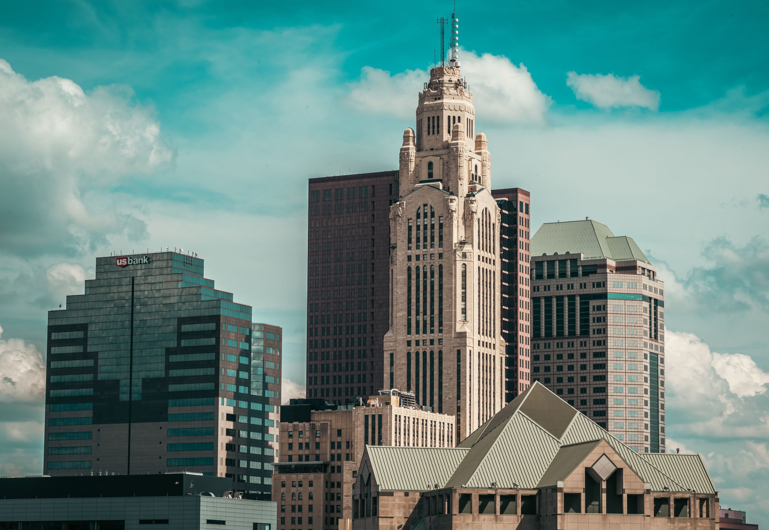 Skyline view of downtown Columbus, Ohio, with LeVeque Tower against a cloudy sky.