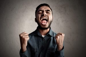 Asian man celebrating