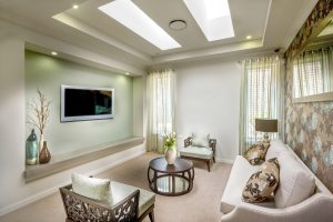 Affluent living room with a sofa set, center table, chairs, and a television