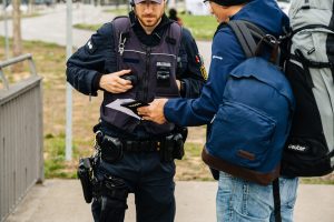 Kehl, Germany - Mar 16, 2020: German Polizei Police officers ID passport check people at the border crossing in Kehl from France Strasbourg during crisis measures against novel coronavirus