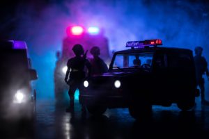 Corona virus concept with police. Stay home for precautionary measures to prevent from corona virus. Anti-riot police give signal to be ready. Smoke on a dark background with lights. Selective focus
