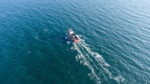 up view of sea water and boat in summer