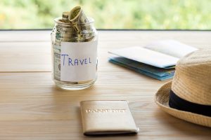 objects for travel isolated on a wooden background.