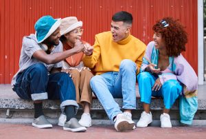 Funny, university and friends in city, happy on holiday, adventure and weekend together. Travel, college students and men and women laugh in urban town for bonding, conversation and fun on vacation