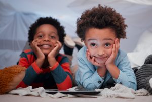 Brothers for life. two little brothers using a digital tablet together at home.