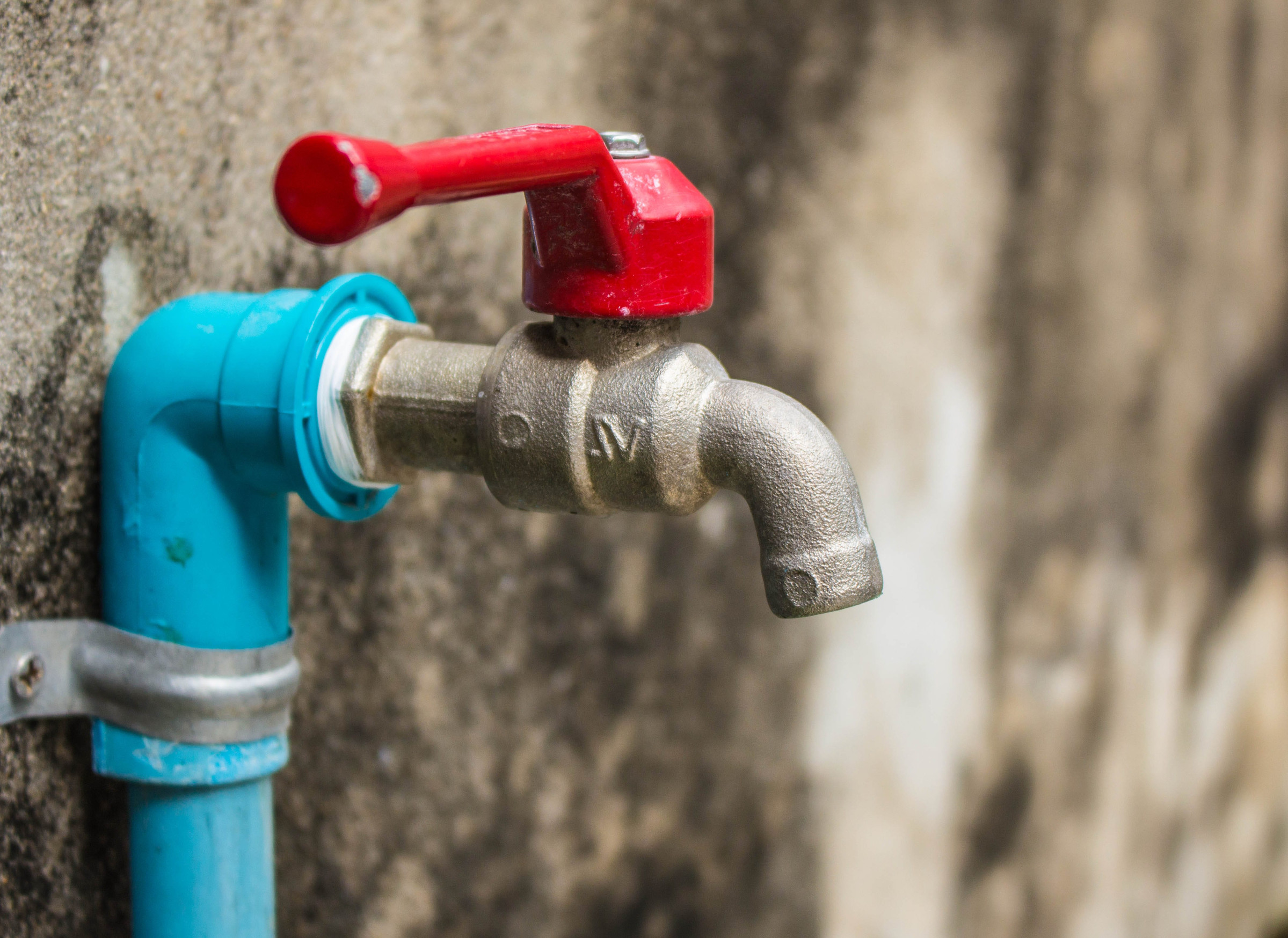 Faucet on a wall inside the home.