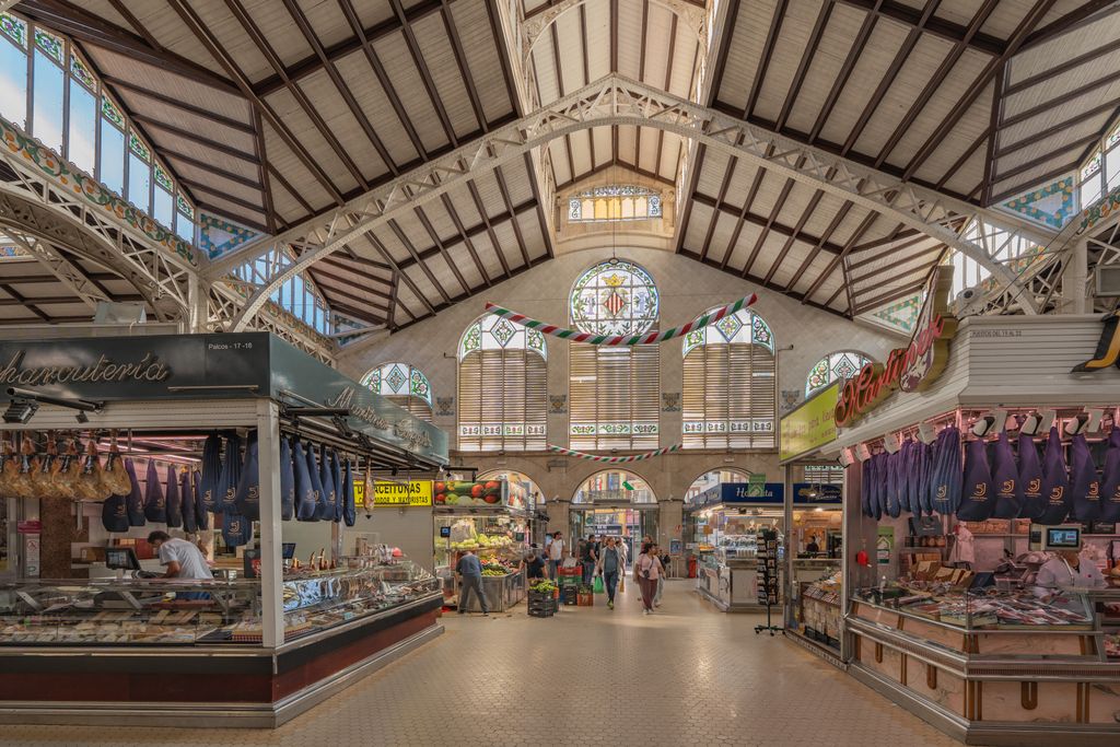 Captivating interior of Valencia's Central Market showcasing vibrant food stalls.