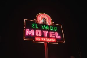 sign-of-the-el-vado-motel-glowing-outdoors-at-night-
