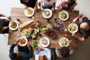 group-of-people-eating-together-