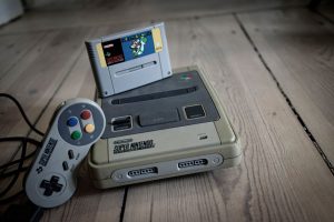 old-video-game-pad-with-controller-and-cassette-