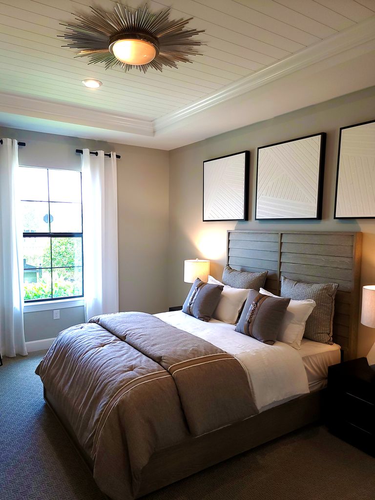 Stylish bedroom interior featuring neutral tones and contemporary decor.