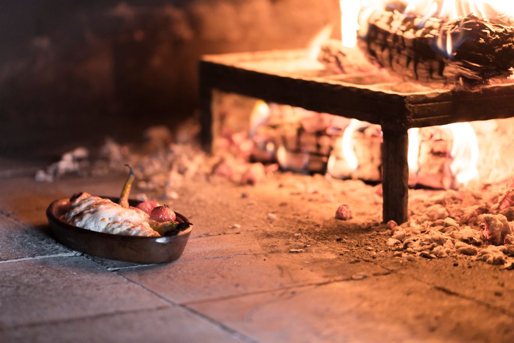 Delicious Turkish dish cooking in a traditional stone oven, showcasing authentic culinary heritage.